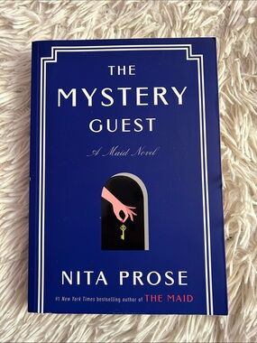 The Mystery Guest by Nita Prose - Blue paperback Novel, like new